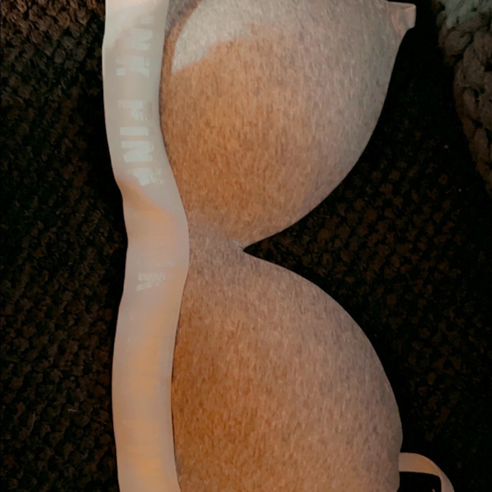 Brand new Victorias Secret bra 32 DD. Never worn. Grey with white band.